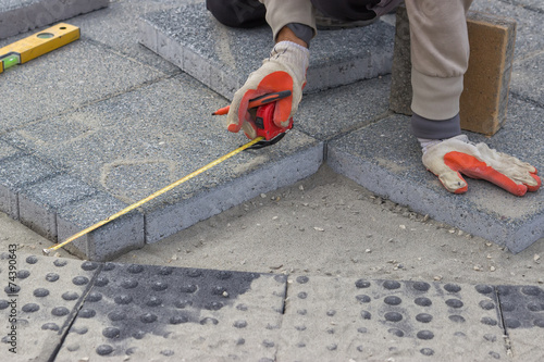 Paver measuring irregular space for laying concrete brick 2