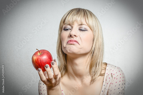 Bild auf Leinwand Blonde Girl with Apple