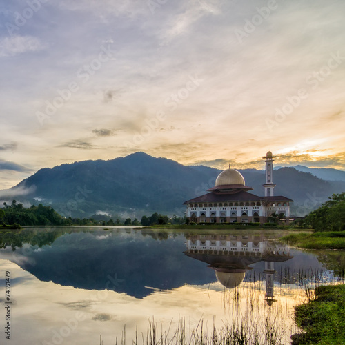 Beautiful mosque with reflection by the lakeside