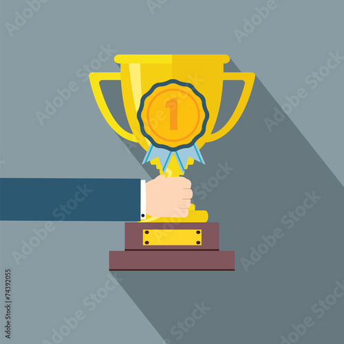 Hand holding a Trophy cup