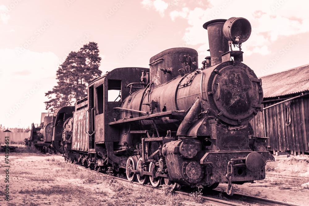 old rusty steam locomotive in retro style in brown tones old rusty steam locomotive in retro style in brown tones