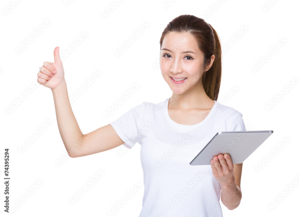 Woman use of tablet and thumb up Woman use of tablet and thumb up
