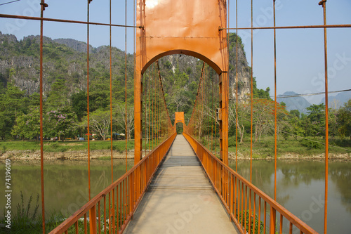 Pedestrian bridge across Nam Song river, Vang Vieng, Laos.