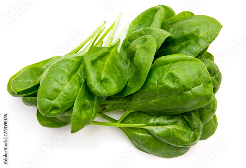 Fresh spinach leaves on a white background seen from above