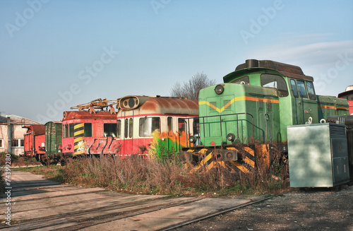 Old abandoned trains at depot in sunny day