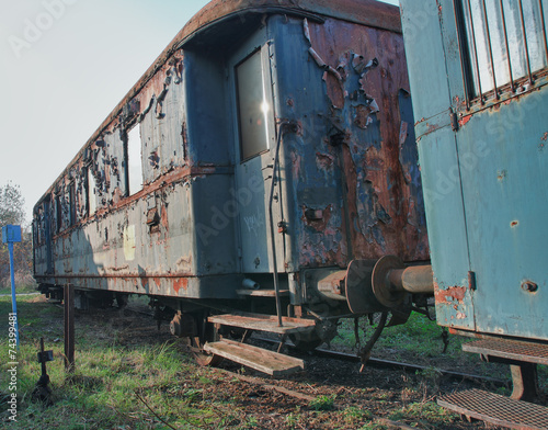 Old abandoned trains at depot in sunny day