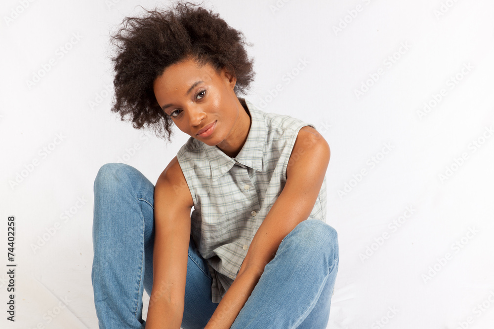 Black woman sitting thoughtfully Black woman sitting thoughtfully