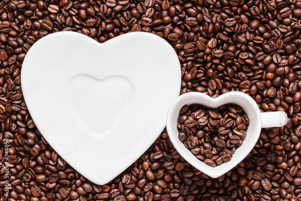 cup and saucer on coffee beans background cup and saucer on coffee beans background