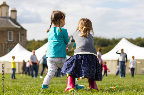 Two cute little girls playing together