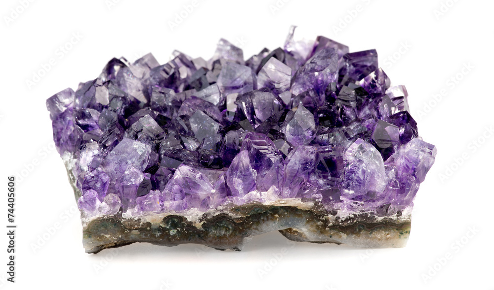 Macro closeup of purple amethyst geode on white background Macro closeup of purple amethyst geode on white background