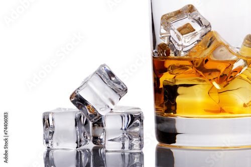 Whisky in a glass with ice cubes