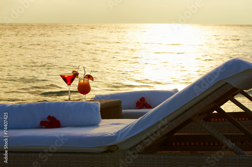 Photography Loungers At Edge Of Tropical Sea With Cocktails