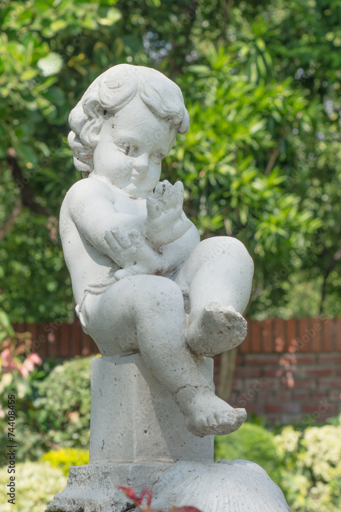Stone statue of a child