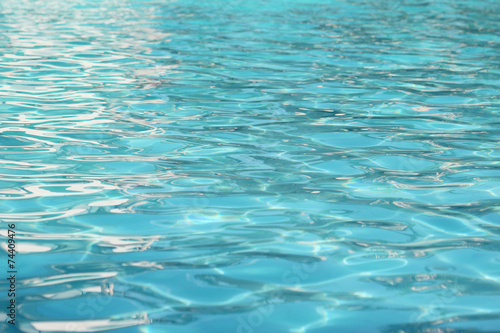 Cyan Swimming Pool water surface background . © ruksil