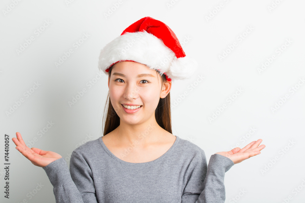 Young asian woman with Christmas hat isolated on white. Young asian woman with Christmas hat isolated on white.
