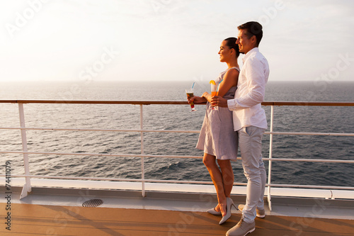 side view of couple having cocktails on cruise ship