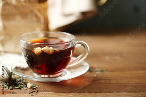 Beautiful vintage composition with herbal tea, on wooden table