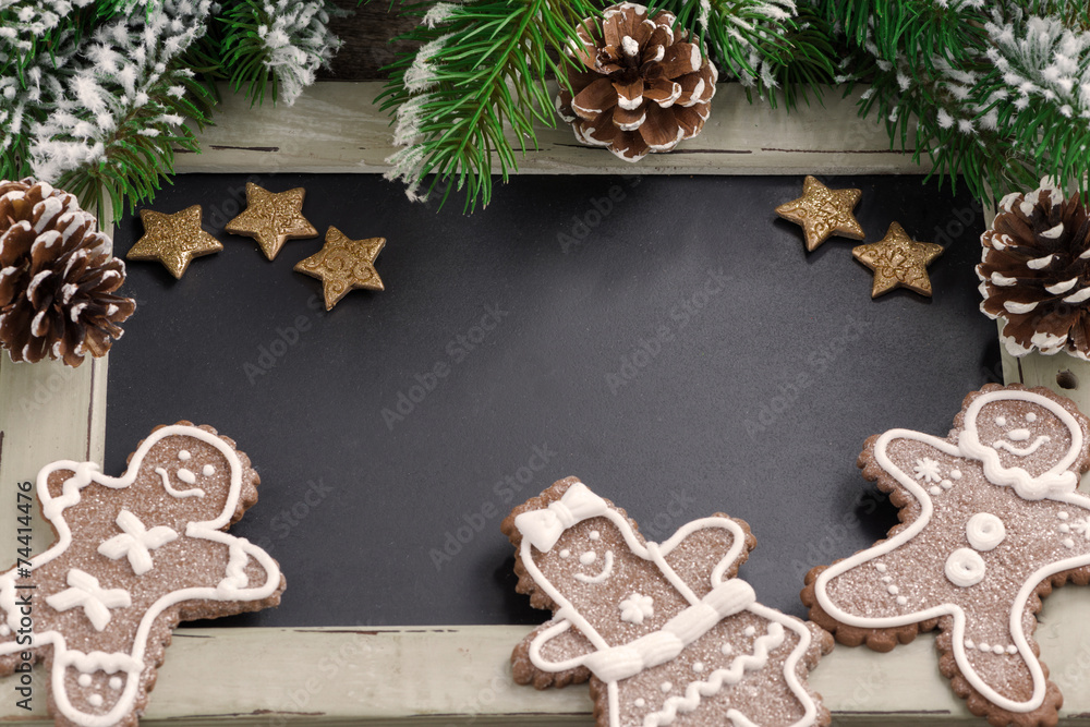 Christmas concept. Black board for text and gingerbread man Christmas concept. Black board for text and gingerbread man