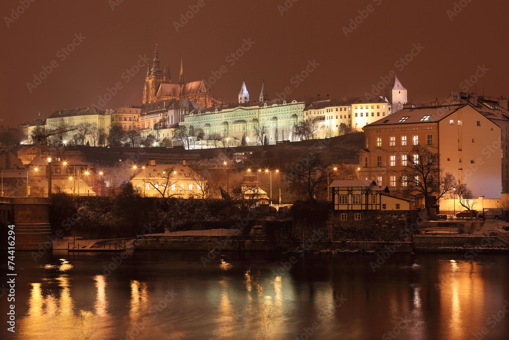 Night  romantic snowy Prague gothic Castle above River Vltava