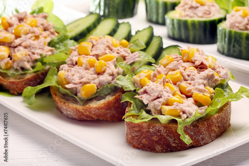 Sandwich with tuna and corn on white background