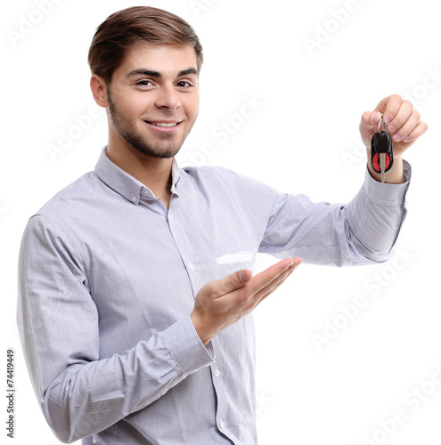 Businessman holding car key...