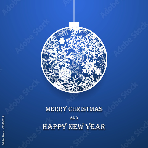 New year ball made of paper snowflakes on blue background photo