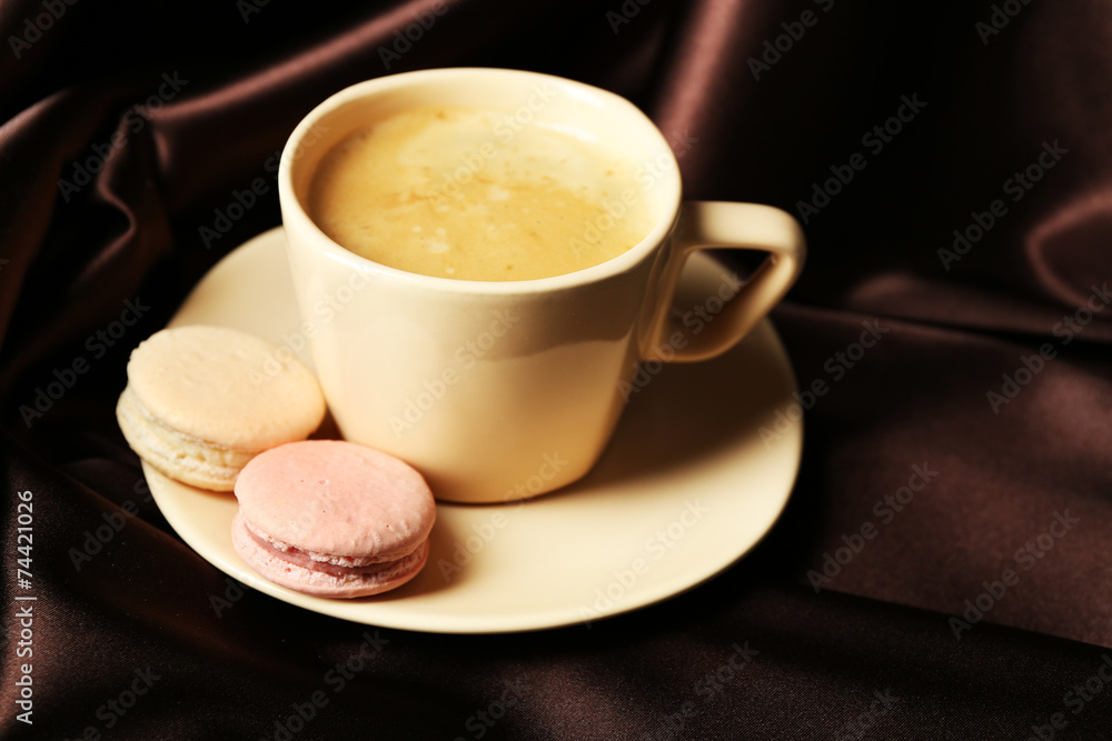 Gentle colorful macaroons and black coffee in mug Gentle colorful macaroons and black coffee in mug