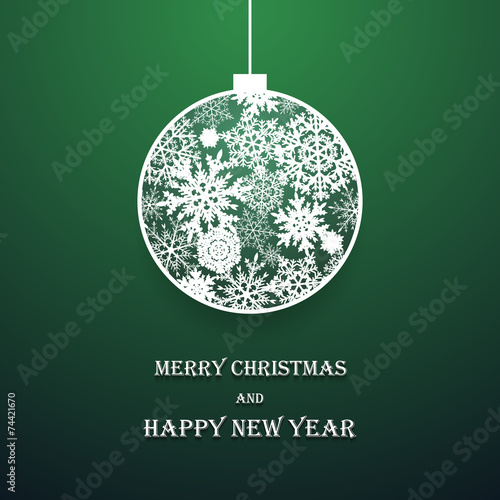 New year ball made of paper snowflakes on green background