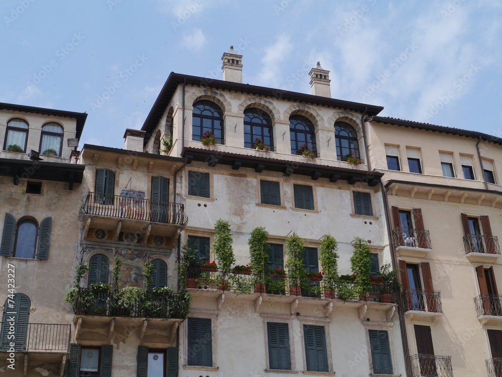 A balcony of an ancient house in Verona in Italy