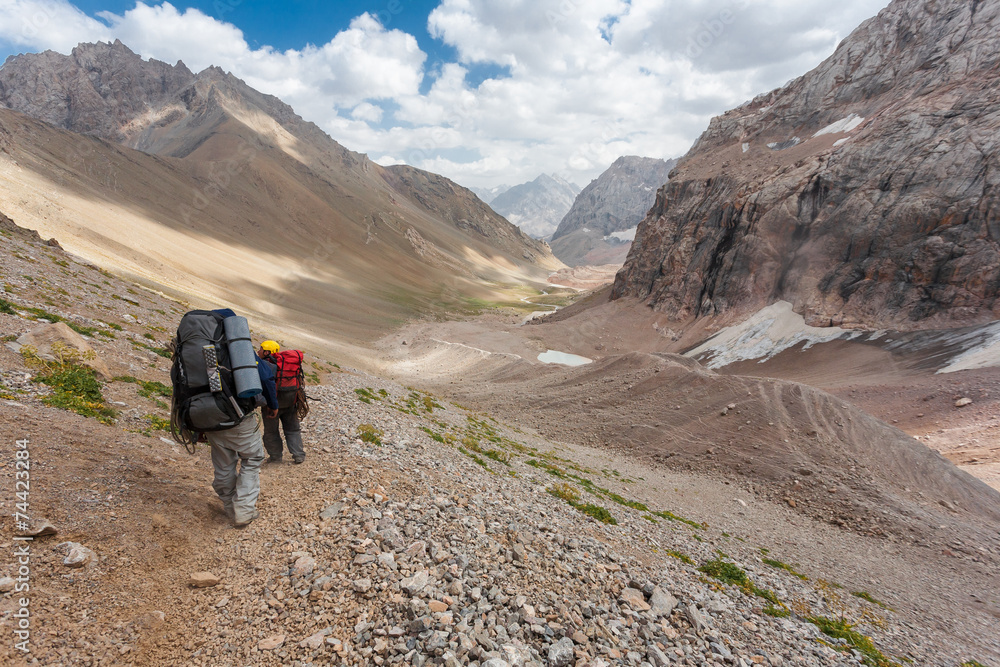 Fototapeta premium Hikers in high mountains.