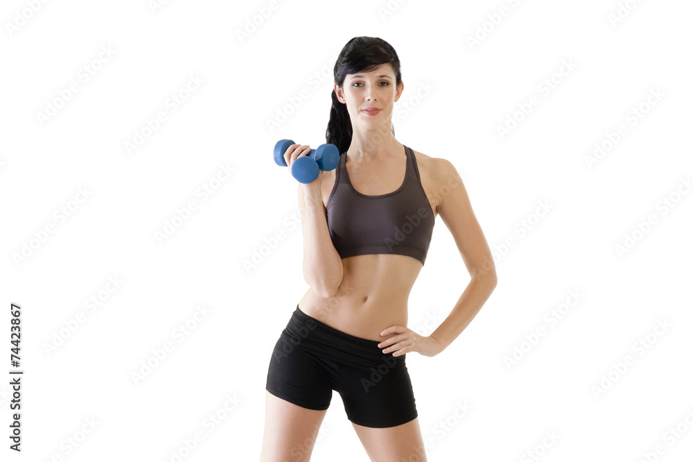 Young woman exercising with dumbbells isolated on white Young woman exercising with dumbbells isolated on white