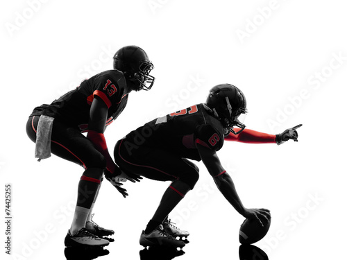 two american football players on scrimmage silhouette
