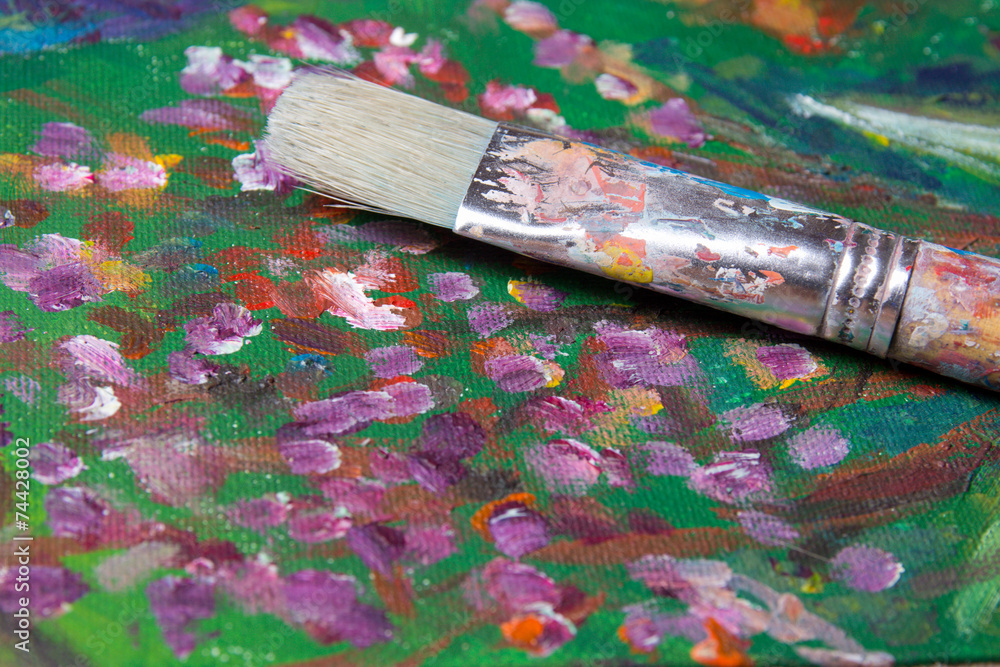Fototapeta premium used paint brush on canvas background
