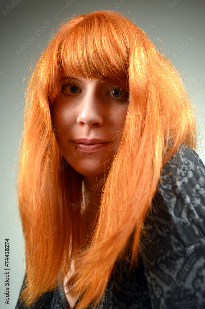 Naklejka premium Portrait of a red haired Woman