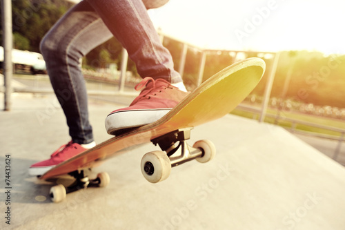  skateboarding legs at skatepark