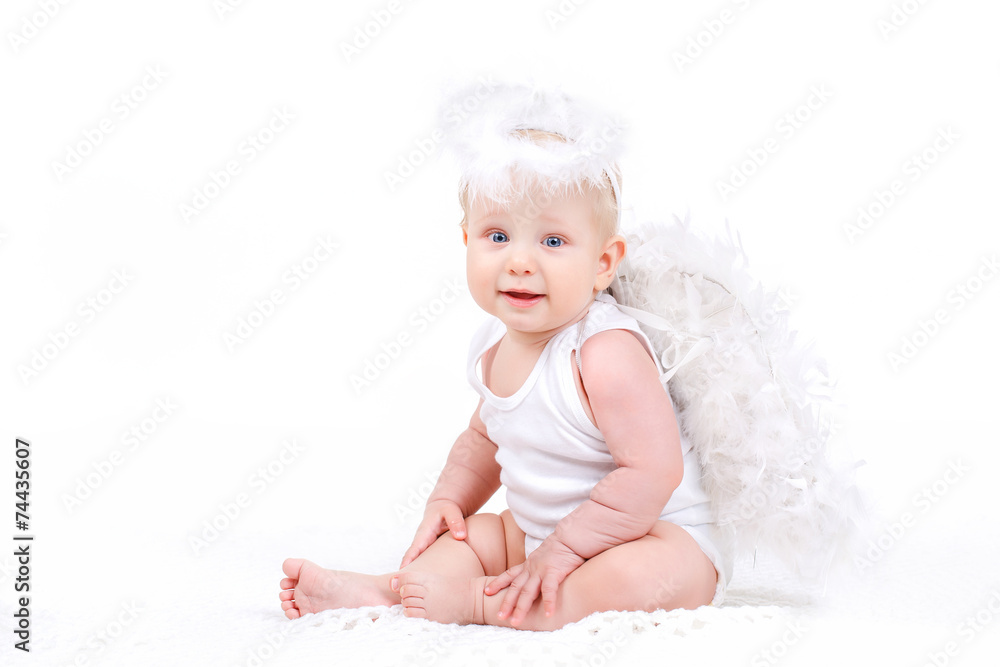 Small angel with the wings isolated on the white. Small angel with the wings isolated on the white.