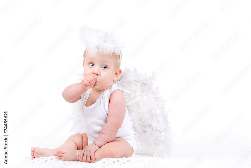 Small angel with the wings isolated on the white. Small angel with the wings isolated on the white.