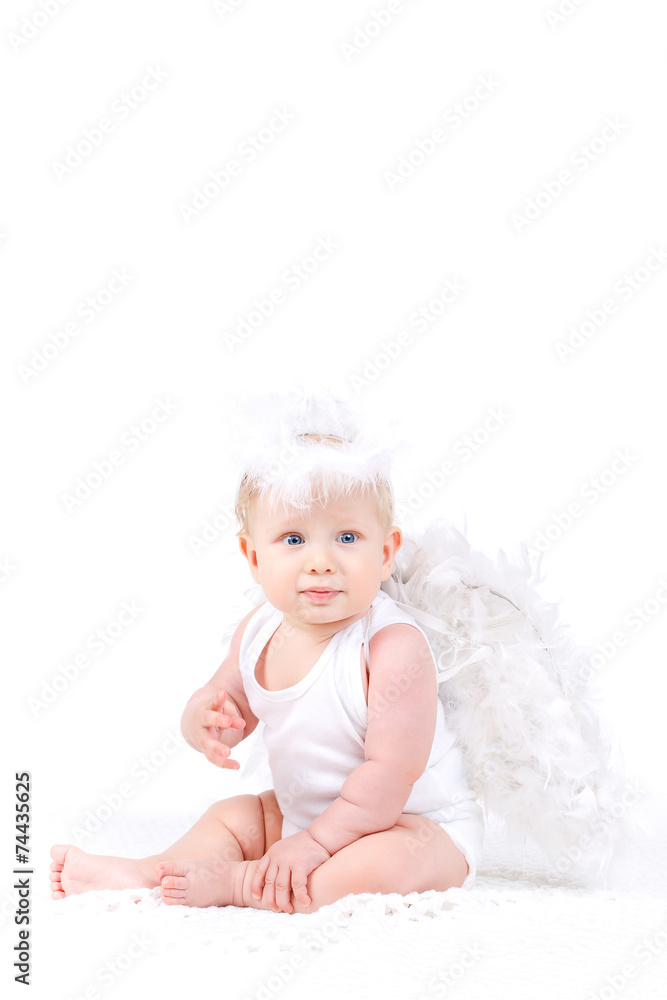 Small angel with the wings isolated on the white. Small angel with the wings isolated on the white.