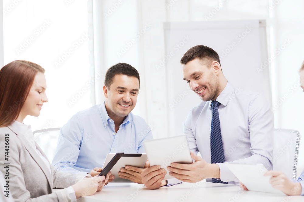 business team working with tablet pc in office business team working with tablet pc in office