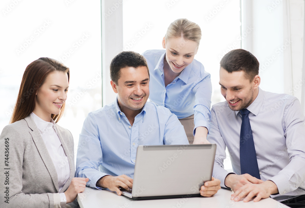 business team working with laptop in office business team working with laptop in office