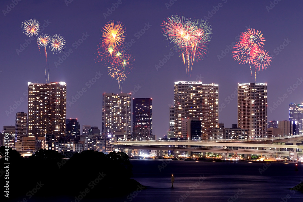 Fireworks celebrating over Odaiba, Tokyo cityscape at night