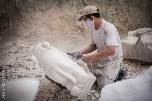 Sculpting a marble elephant