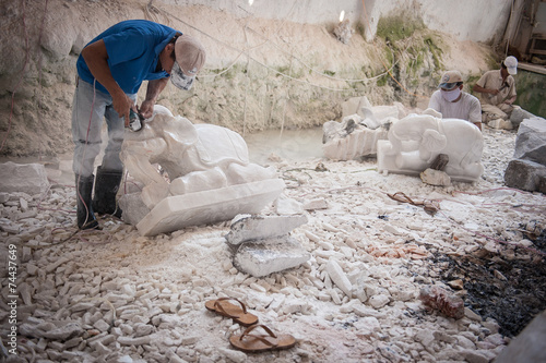 Sculpting a marble elephant