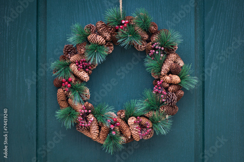 Christmas wreath on a wooden green door
