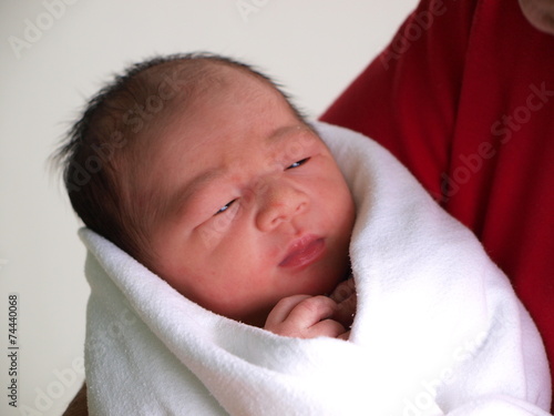 woman holding newborn child