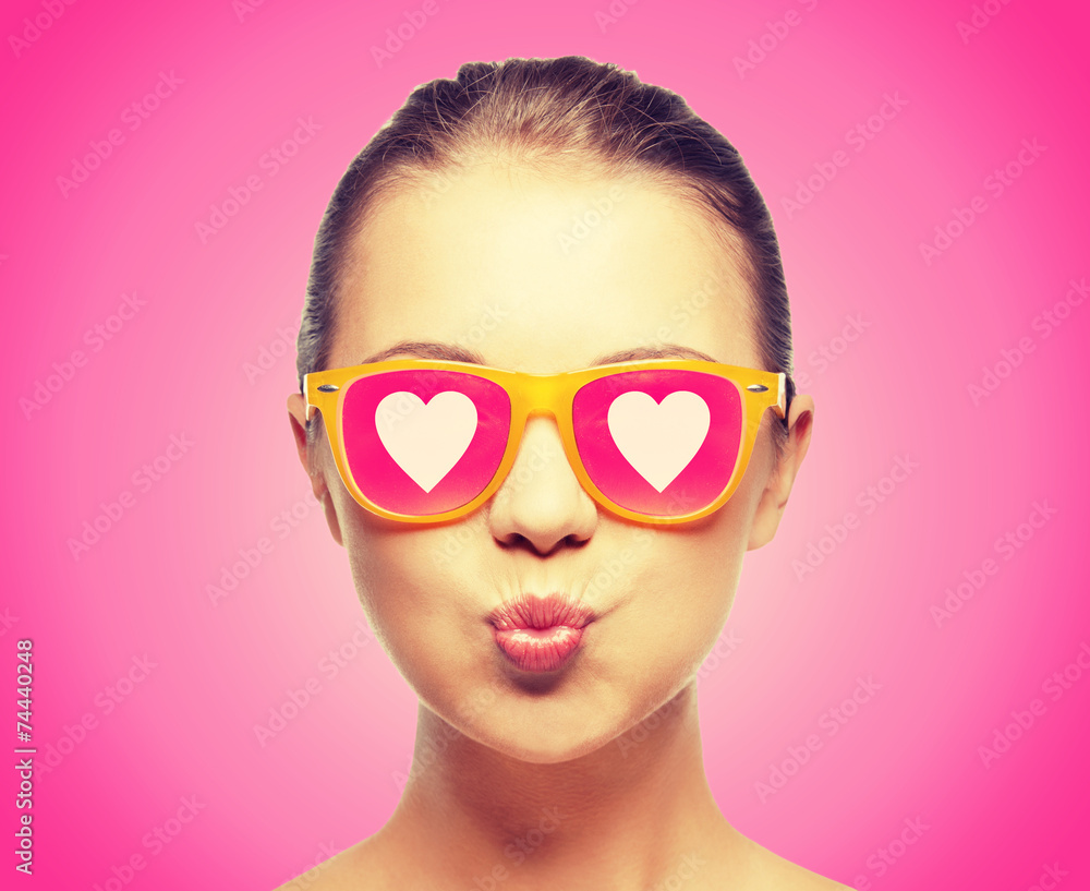 girl in pink sunglasses blowing kiss girl in pink sunglasses blowing kiss