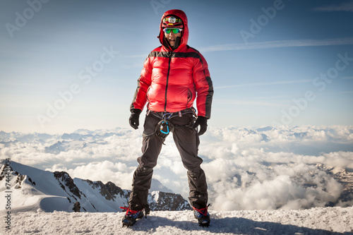 Climber on the summit of Mont Blanc
