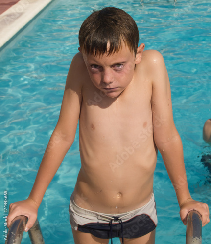 serius 9 year old boy summer time © olga