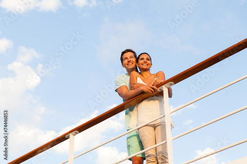 young man standing with his girlfriend on cruise