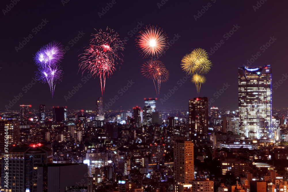 Fototapeta premium Fireworks celebrating over Tokyo cityscape at night